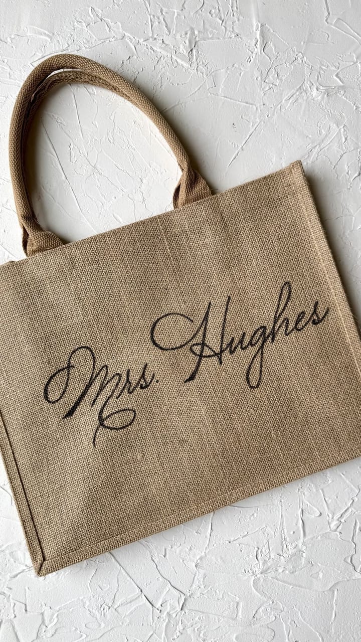 Jute tote bag hand-lettered with a bride's new last name