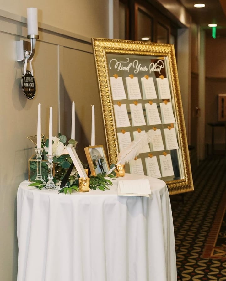 Find Your Seat mirror seating chart displayed in a reception hallway
