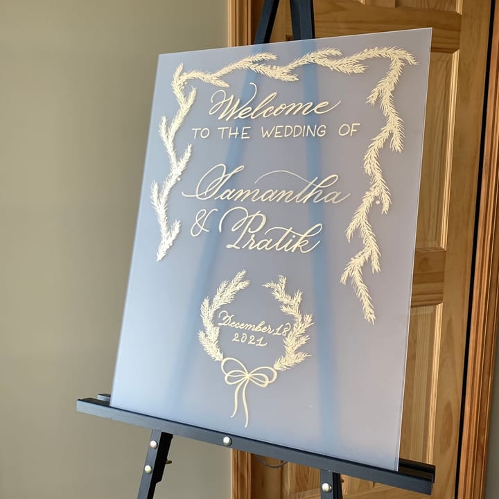 Large wedding welcome sign on acrylic with painted greenery